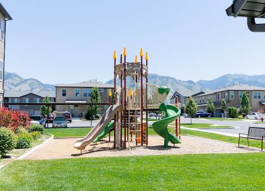 Four Seasons Logan Apartments and Townhomes Playground in Courtyard