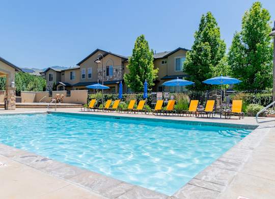 Four Seasons Logan Apartments and Townhomes Sparkling Pool on a Warm Day
