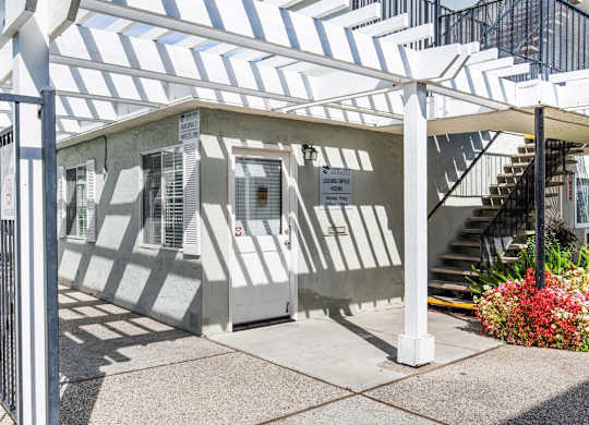 A building with a white and grey striped awning.