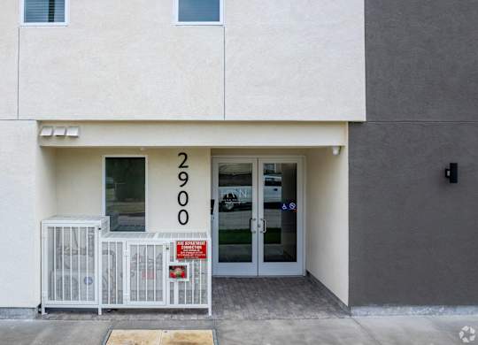 A white building with the number 2900 on the front.
