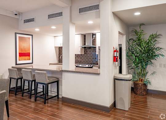 A room with a bar and a potted plant at Oak Park Apartments, Monrovia, 91016