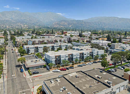 A parking lot with a mountain in the background.