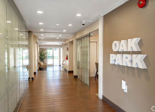 A hallway with the words at Oak Park Apartments, Monrovia, 91016