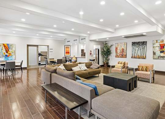 A living room with a grey couch and a coffee table.
