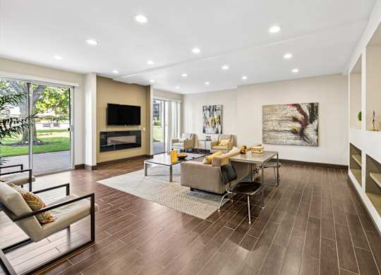 A modern living room with a fireplace and a television.