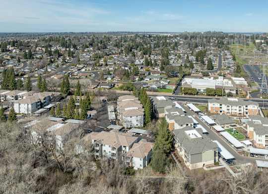A bird's eye view of a residential area with houses and trees.