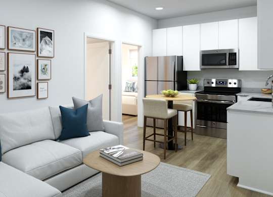 A modern living room with a white couch and a coffee table.