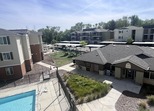 A sunny day at the apartment complex with a swimming pool.