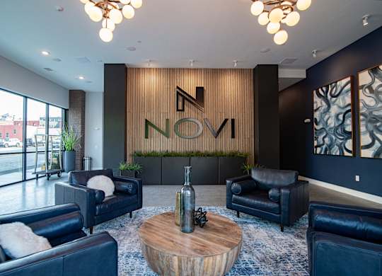 The spacious modern lobby of Novi Flats