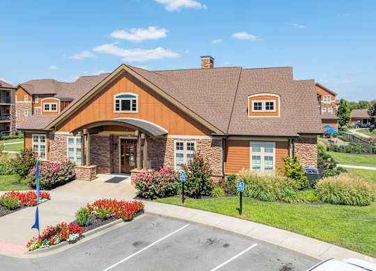 a house with a sidewalk in front of a parking lot