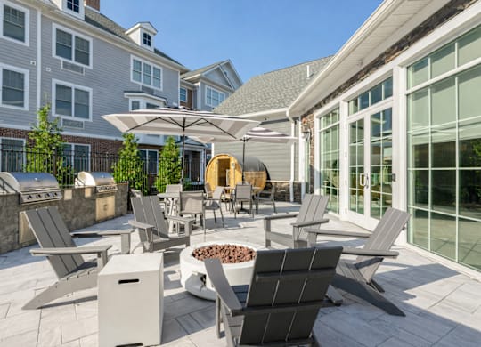 Resident outdoor patio with lounge seating at The Rail North Bergen