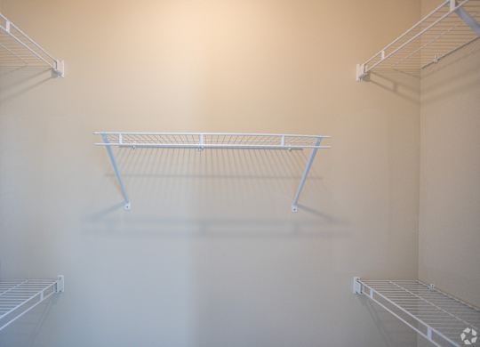 a empty closet in a room with white walls