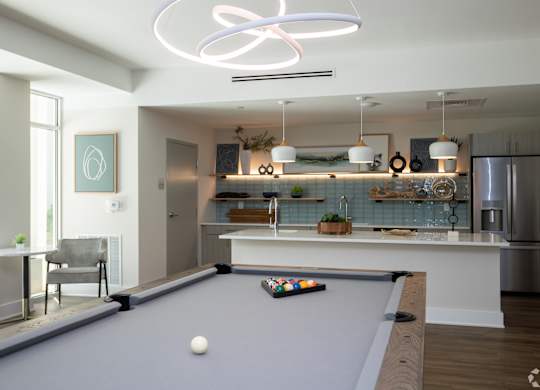 A pool table with a white ball on it.