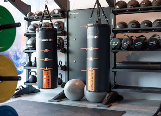 Punching bag and weights at Novi Flats' fitness center