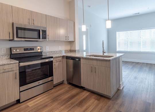 Gourmet kitchen with peninsula layout at Novi Rise Apartments in Concord, NC