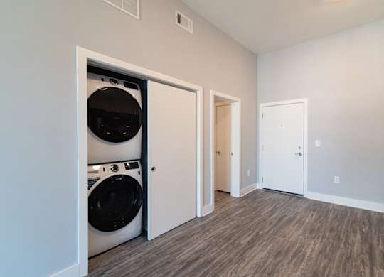 Full-sized, front-loading washer and dryer at Novi Flats luxury apartments in Concord, NC