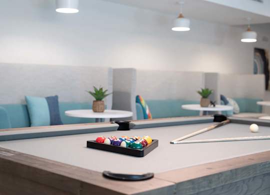 The pool table in the game room at Novi Rise