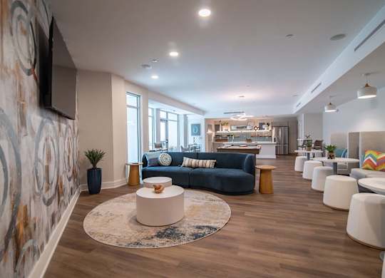 Sitting area and tables in Novi Rise's resident lounge