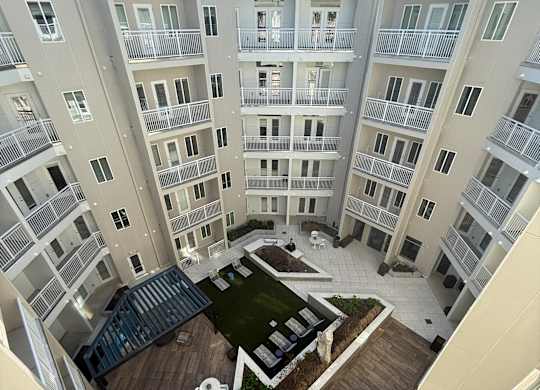 Apartment complex with a courtyard in the middle.
