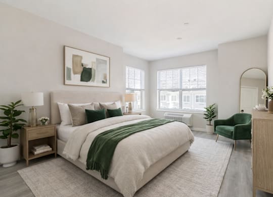 Spacious bedroom with large windows at The Rail North Bergen luxury apartments