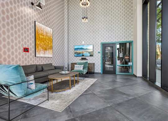 A living room with a grey sofa and a coffee table.