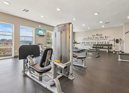A gym with a sign that says "The Run You Can Do It Yourself Push Yourself Discipline".