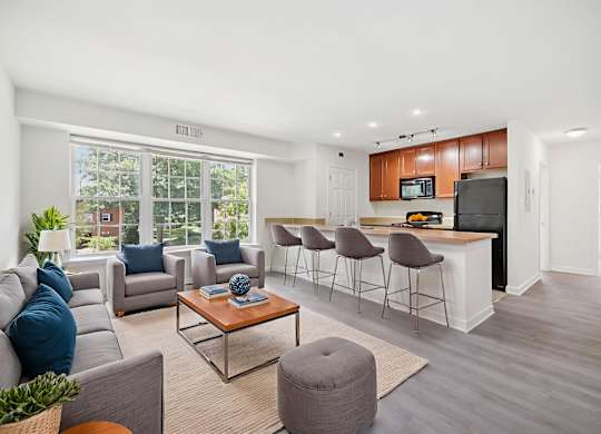 A living room with a grey sofa and a coffee table.
