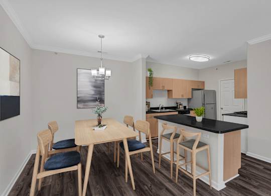 A kitchen with a table and chairs.