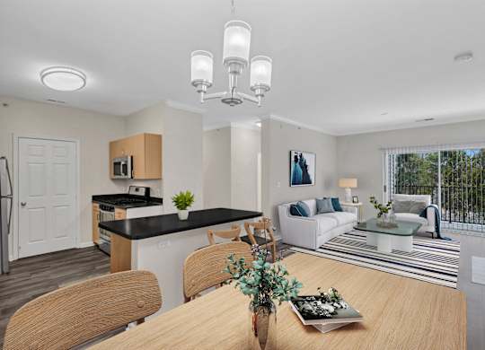 A modern kitchen with a dining table set for four.