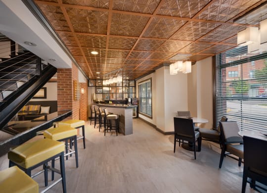 Stylish Resident Lounge with Fireplace, Wet Bar, and Plush Seating Areas at The Cosmopolitan at Lorton Station, Lorton, VA