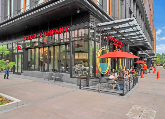 a rendering of a good company restaurant on a city street
