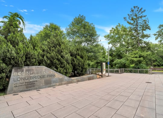 a park with trees and a stone sign that says bohemia
