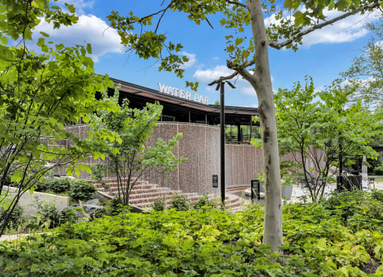 a view of the front of a building with trees