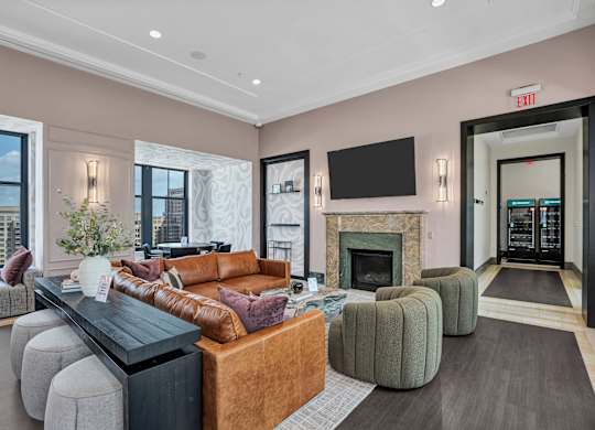 A living room with a fireplace and a large couch.