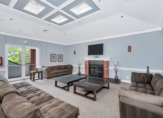 a living room filled with furniture and a fireplace