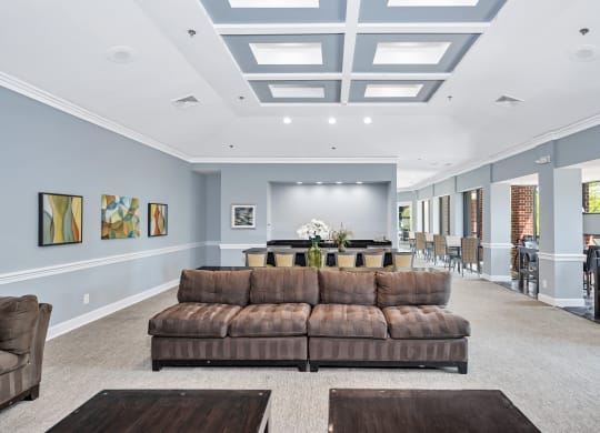 a living room filled with furniture and a large window