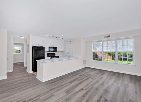 a kitchen and living room in a 555 waverly unit