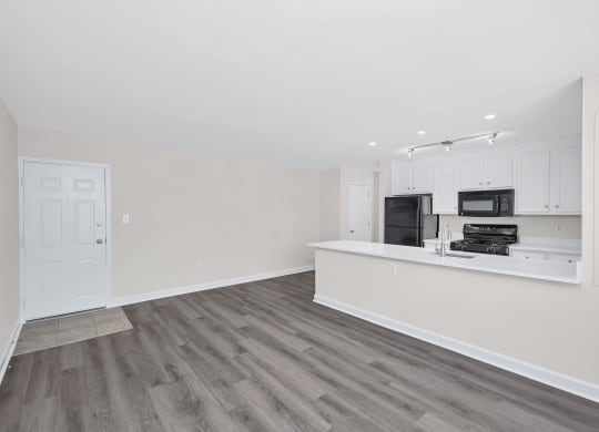 a kitchen and living room in a 555 waverly unit