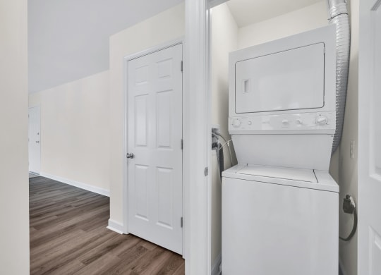 a room with a washer and dryer in it