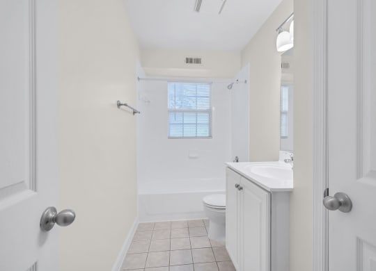 a bathroom with a toilet sink and bathtub