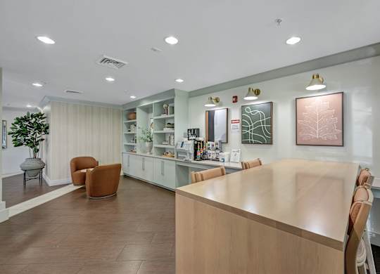 A reception area with a long counter and chairs.