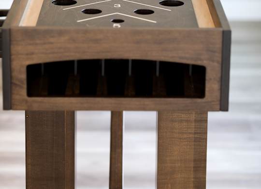 a close up of the shuffleboard table