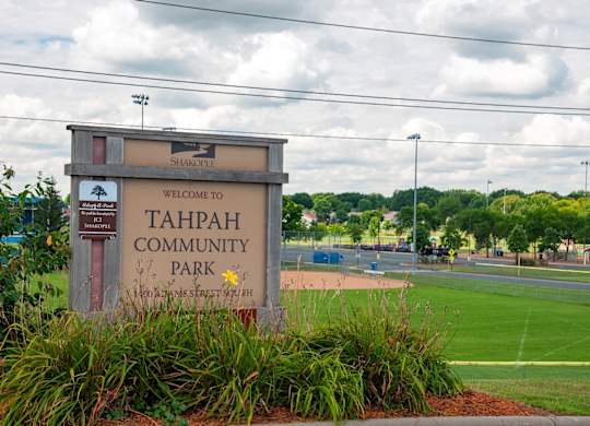 A sign welcoming people to Tahpah Community Park.