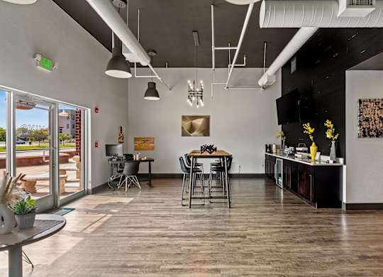 A modern interior with a dining area and a kitchenette. at Vivo Toledo Apartments, Toledo, OH