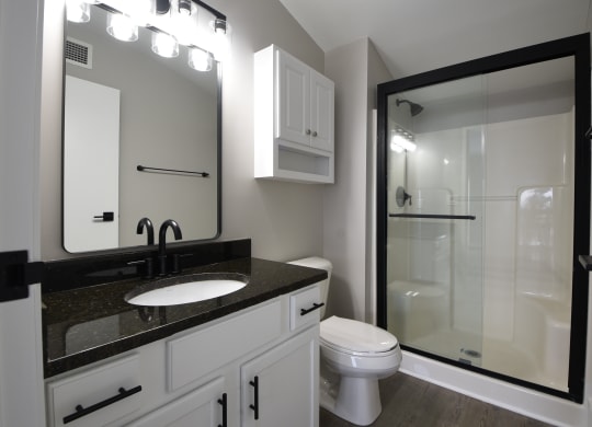 a bathroom with granite counter tops at Marshall Place, Cleveland