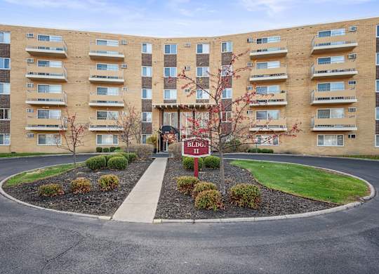 Apartment complex with a red sign that says