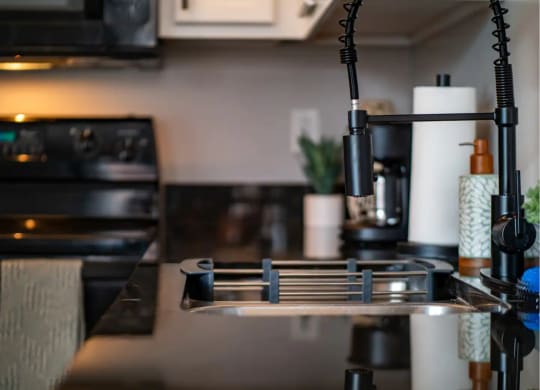 a kitchen with a sink and a stove