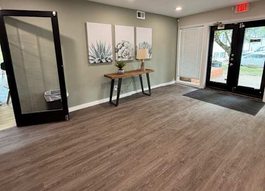 Lounge Area with a wooden floor and a glass door at The Retreat at Walnut Creek, Columbus , OH
