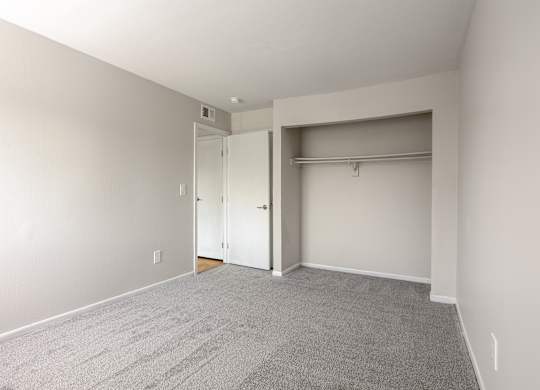 A room with a carpeted floor and white walls. at Commons At Waters Edge, Columbus Ohio