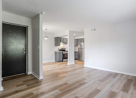 A room with a black door and wooden flooring. at Commons At Waters Edge, Columbus Ohio